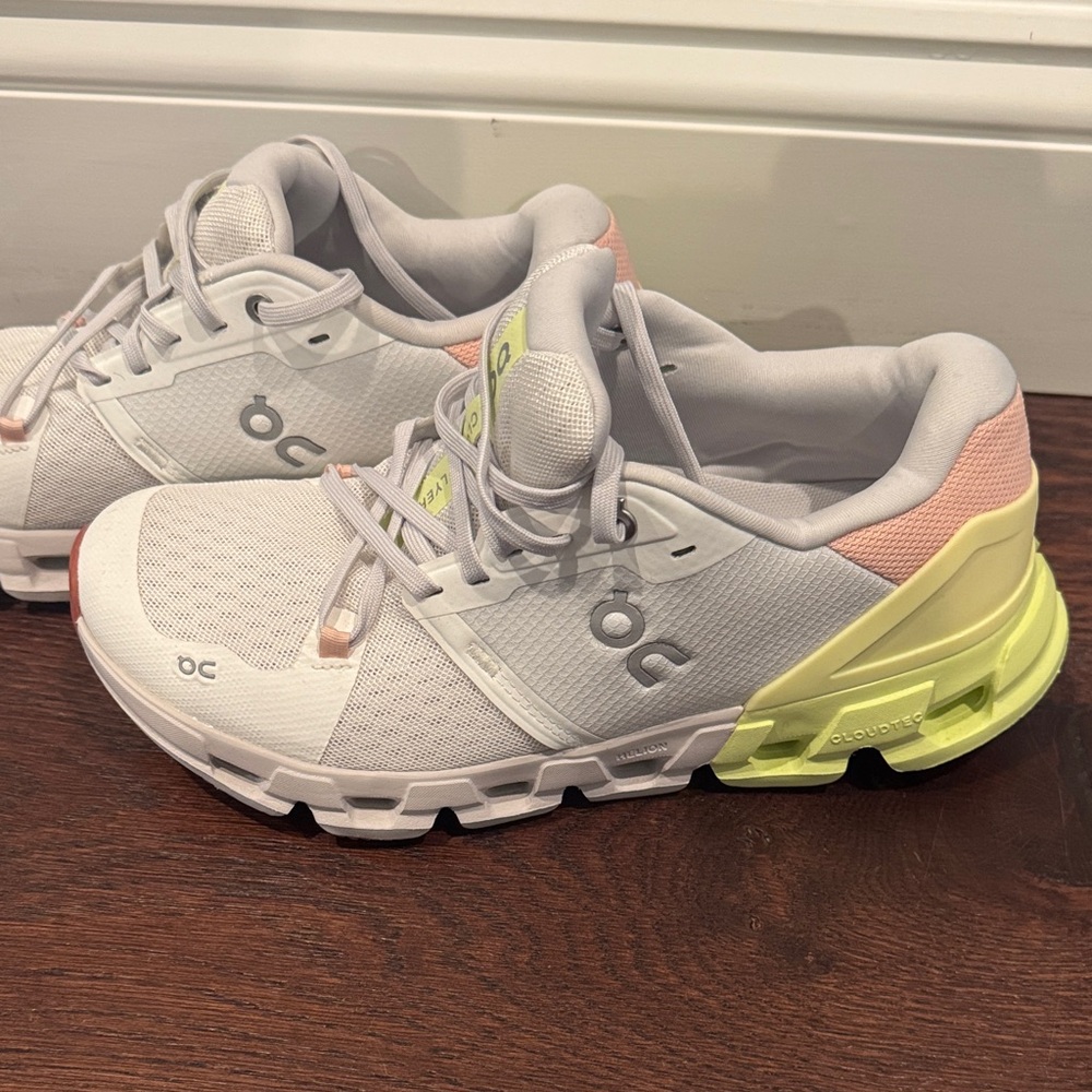 On Running cloud flyer White Sneakers with Yellow and Pink Accents